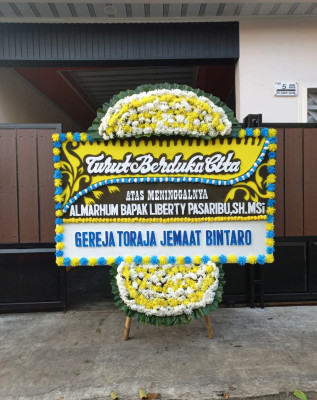Papan Bunga Duka di Kakaskasen Dua